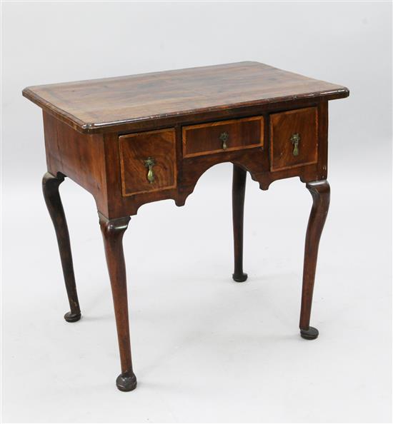 A George II crossbanded walnut lowboy, W.2ft 4in. D.1ft 8in. H.2ft 4in.